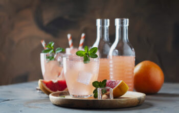 Pink cocktail with grapefruit and mint, selective focus