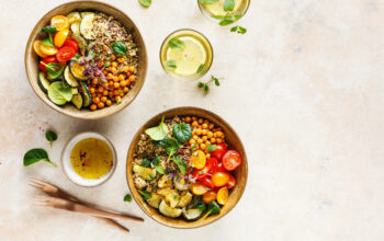 Quinoa, chickpeas and vegetables bowls. Healthy vegan lunch bowls. Food background with copyspace. Top view.